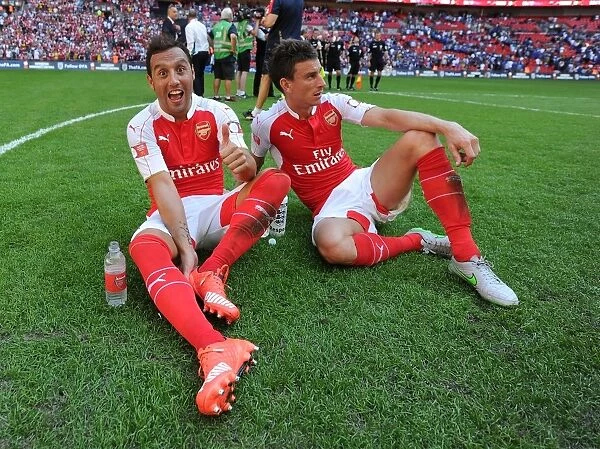 Arsenal Celebrate Community Shield Victory over Chelsea (2015): Santi Cazorla and Laurent Koscielny Rejoice