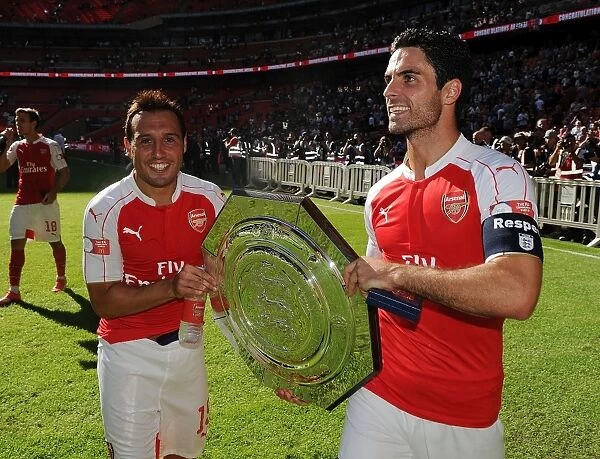 Arsenal Celebrate Community Shield Victory over Chelsea (2015-16): Santi Cazorla and Mikel Arteta Rejoice