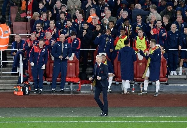 Arsenal Celebrates First Goal Against Manchester City (2015-16): Arsene Wenger and Team's Jubilant Reaction on the Emirates Stadium Bench