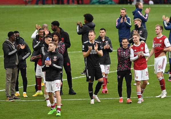 Arsenal Clinches Premier League Title: Bernd Leno Celebrates with Fans after Victory over Brighton