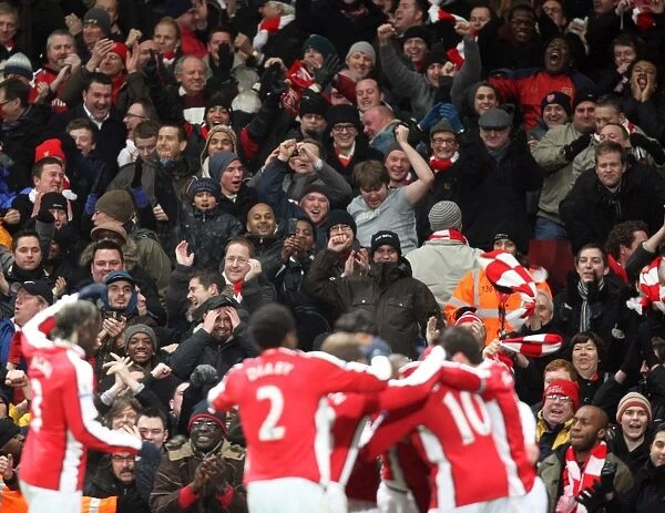 Arsenal Fans Go Wild: Celebrating the 3rd Goal in a 4-2 Victory over Bolton Wanderers (Barclays Premier League, Emirates Stadium, 20 / 1 / 10)