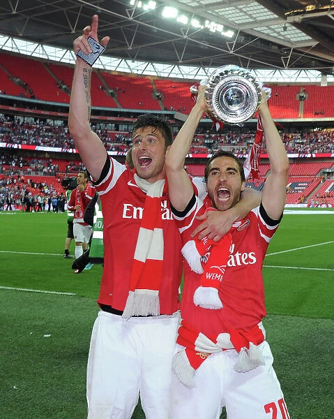 Arsenal FC Celebrates FA Cup Victory: Olivier Giroud and Mathieu Flamini with the Trophy