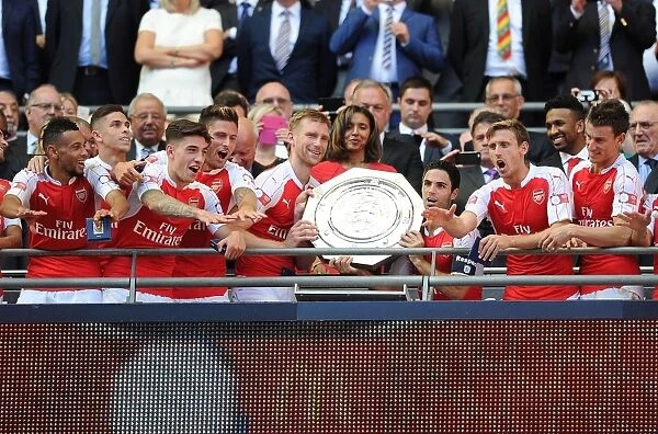 Arsenal FC: Mertesacker and Arteta Receive FA Community Shield from Janet Rocastle