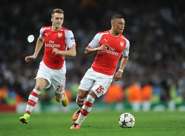 Arsenal FC: Oxlade-Chamberlain and Chambers in Action during the 2014 UEFA Champions League Qualifier