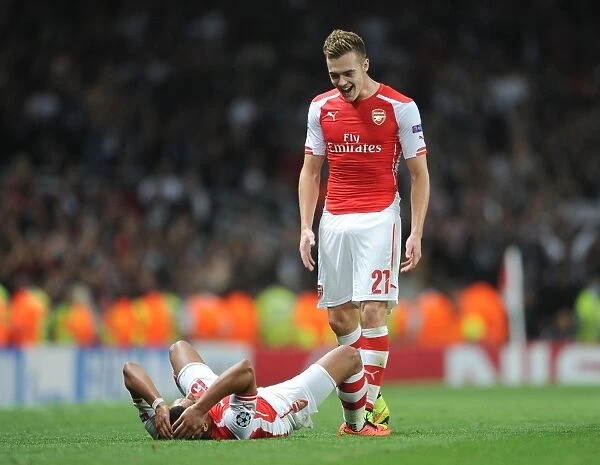 Arsenal FC: Oxlade-Chamberlain and Chambers Celebrate after Arsenal's Win against Besiktas in the UEFA Champions League Qualifiers (2014)