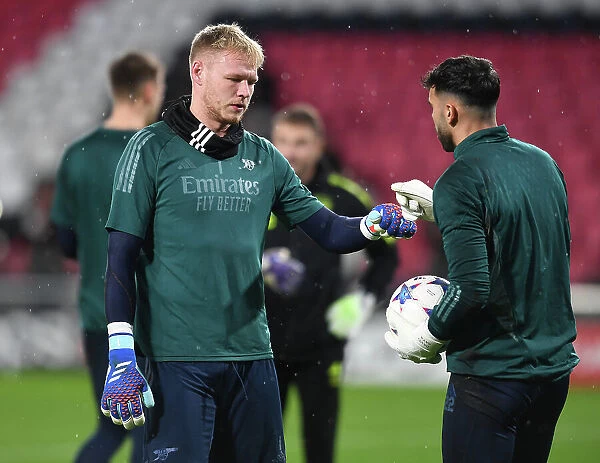 Arsenal FC Players Aaron Ramsdale and David Raya Warm Up Ahead of PSV Eindhoven Clash in 2023-24 UEFA Champions League