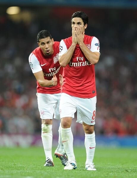 Arsenal FC vs Olympiacos FC: Mikel Arteta and Andre Santos in Action, UEFA Champions League 2011-12