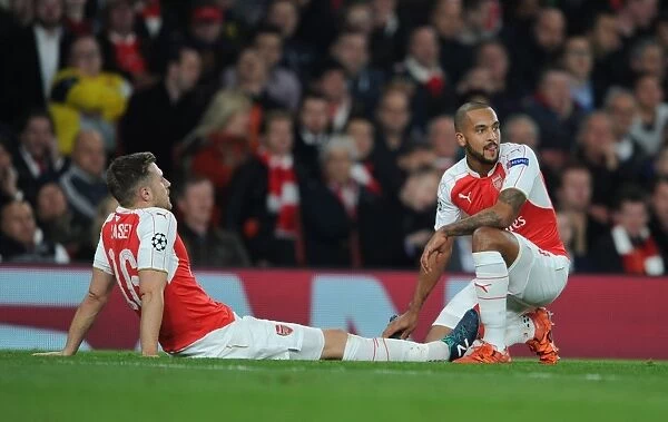 Arsenal FC: Walcott Comforts Injured Ramsey Amidst 2015 / 16 UEFA Champions League Battle Against FC Bayern Munchen