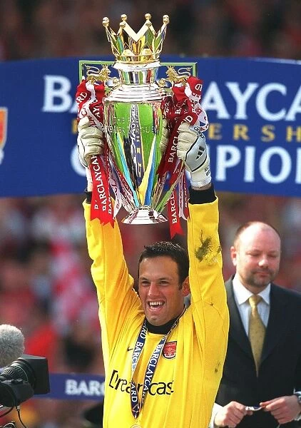 Arsenal goalkeeper Richard Wright lifts the F. A. Barclaycard Premiership Trophy