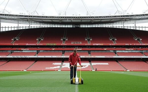 Arsenal Groundsman Prepares Emirates Stadium Pitch for Wigan Athletic Clash (2011-12)