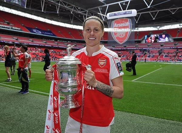 Arsenal Ladies Celebrate FA Cup Victory: Kelly Smith Lifts the Trophy