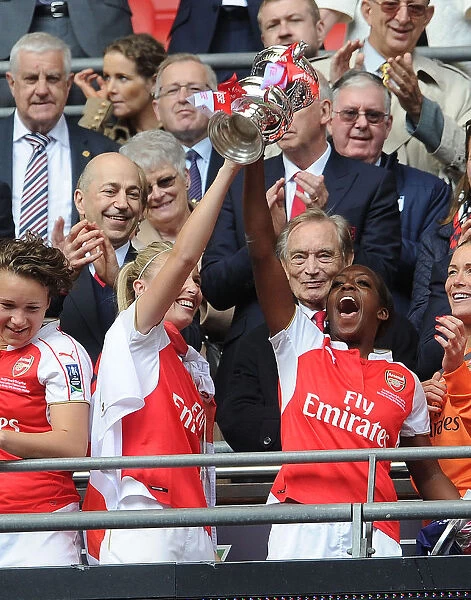 Arsenal Ladies Celebrate FA Cup Victory: Leah Williamson and Danielle Carter Lift the Trophy