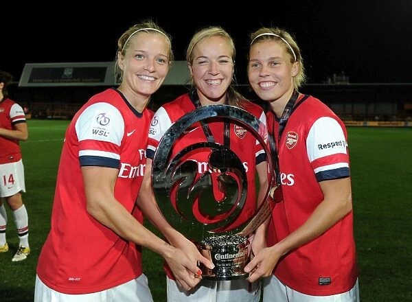 Arsenal Ladies FC Celebrate FA WSL Continental Cup Victory over Birmingham City Ladies FC: Katie Chapman, Gemma Davison, and Gilly Flaherty Hold the Trophy