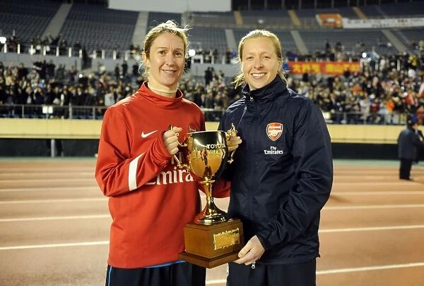 Arsenal Ladies and INAC Kobe Draw in Charity Match at Nishigaoka Stadium, Tokyo (30 / 11 / 11): Celebrating with the Trophy (Ciara Grant and Jayne Ludlow)