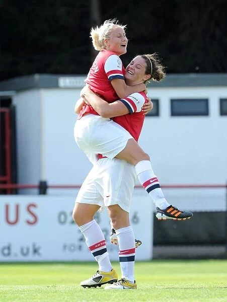 Arsenal Ladies Take the Lead: Beattie and Houghton Celebrate First Goal vs. Lincoln Ladies (FA WSL 2012)