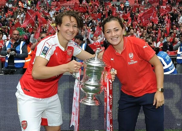 Arsenal Ladies Triumph in FA Cup Final: Henning and McCabe Lift the Trophy