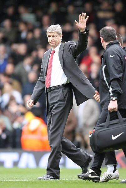 Arsenal manager Arsene Wenger waves to the fans before the match