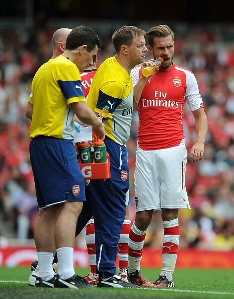 Arsenal Medical Team Tends to Aaron Ramsey During Arsenal v Benfica Match, Emirates Cup 2014-15
