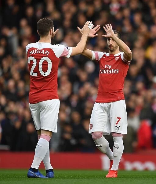 Arsenal: Mustafi and Mkhitaryan's High-Five Moment before the Battle against Tottenham