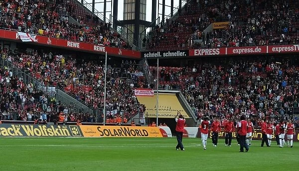 Arsenal Players Wave to Fans After Pre-Season Victory in Cologne