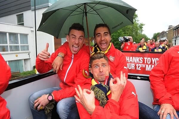 Arsenal Triumph: Koscielny, Giroud, and Flamini Celebrate FA Cup Victory