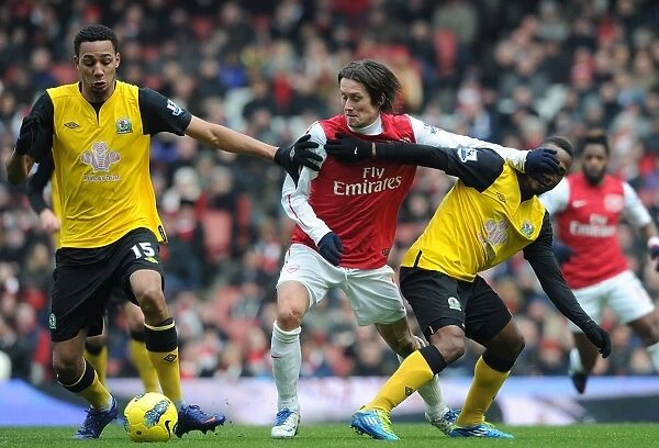 Arsenal vs. Blackburn Rovers: Rosicky Faces Off Against Nzonzi and Howlett in Intense Premier League Clash (2011-12)