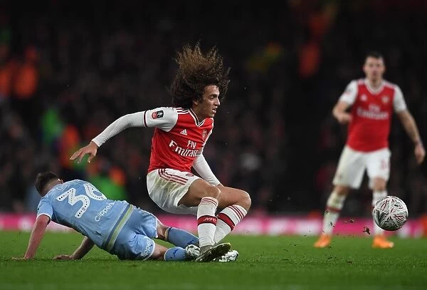 Arsenal vs Leeds United: FA Cup Clash - Guendouzi Tackled by Gotts