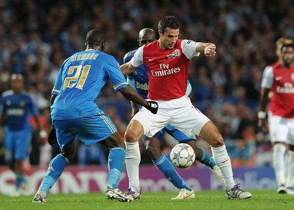 Arsenal vs. Marseille: Robin van Persie Clashes with Souleymane Diawara in the 2011-12 UEFA Champions League