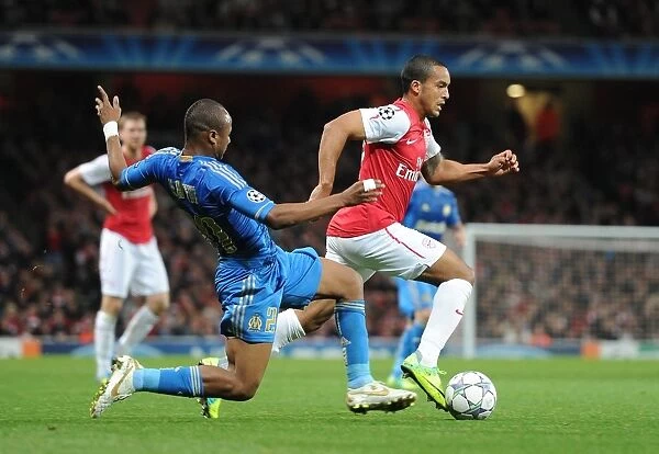 Arsenal vs. Marseille: Theo Walcott Clashes with Souleymane Diawara in the 2011-12 UEFA Champions League