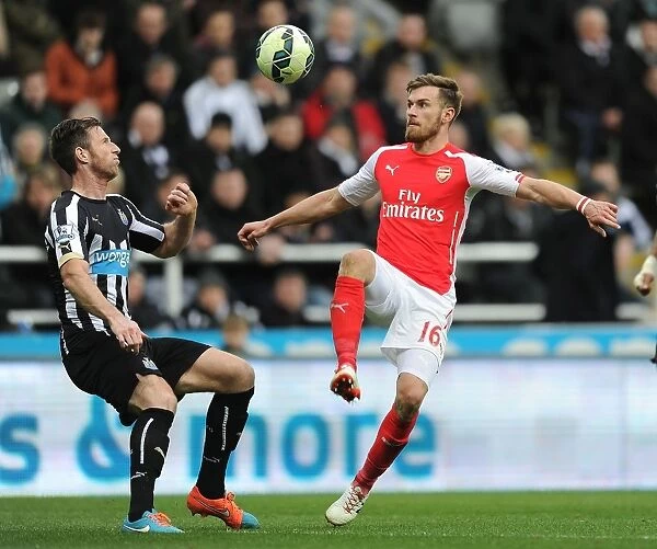 Arsenal vs. Newcastle United: Aaron Ramsey Faces Off Against Mike Williamson in Premier League Clash