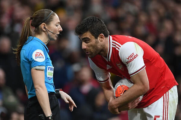 Arsenal vs. West Ham: Sokratis and Referee Sian Massey-Ellis in Action during the Premier League Match
