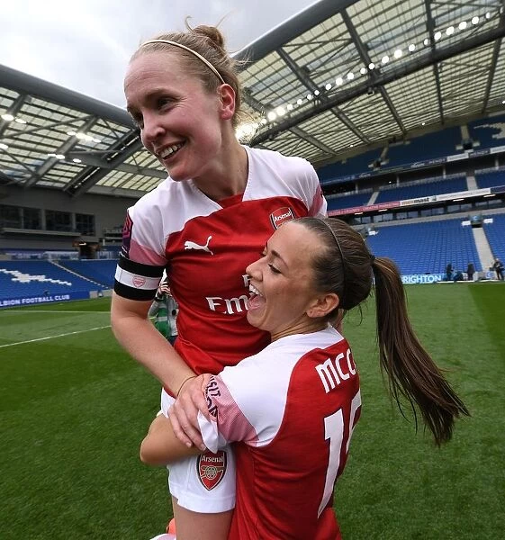 Arsenal Women Celebrate League Victory: Kim Little and Katie McCabe Rejoice after Winning FA WSL Title against Brighton & Hove Albion