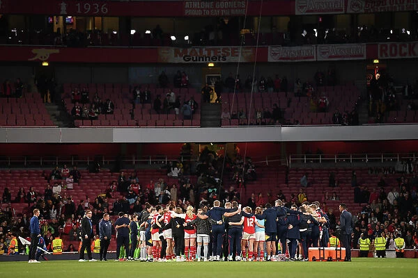 Arsenal Women's Champions League Semifinal: Huddle in the Emirates Stadium After a Hard-Fought Match Against VfL Wolfsburg