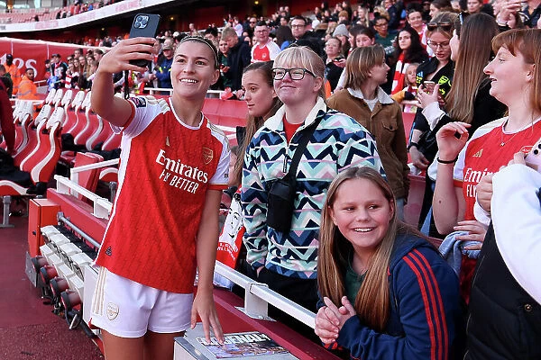 Arsenal Women's Team Celebrates Thrilling Victory over Aston Villa with Elated Fans at Emirates Stadium