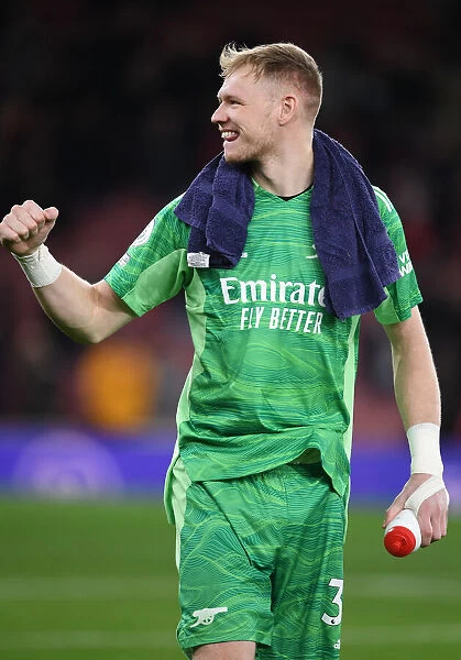 Arsenal's Aaron Ramsdale Celebrates Victory with Ecstatic Fans at Emirates Stadium