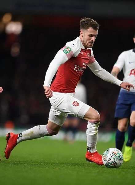Arsenal's Aaron Ramsey in Action: Battle against Tottenham in Carabao Cup