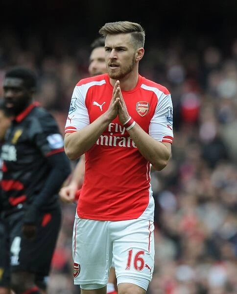 Arsenal's Aaron Ramsey Faces Off Against Liverpool in the Premier League 2014-15