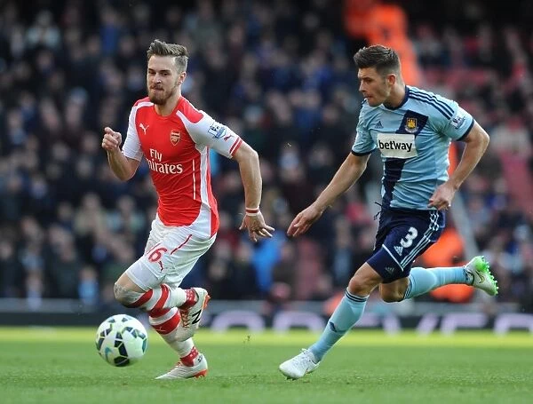 Arsenal's Aaron Ramsey Faces Off Against West Ham's Aaron Creswell in Premier League Clash