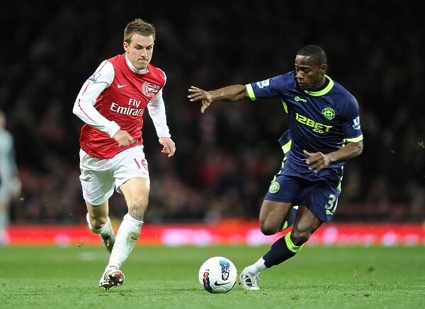 Arsenal's Aaron Ramsey Outmaneuvers Wigan's Maynor Figueroa
