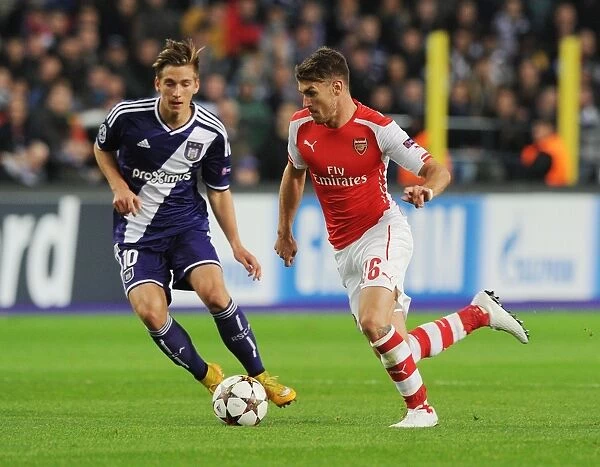 Arsenal's Aaron Ramsey Scores Past Anderlecht's Dennis Praet in 2014-15 Champions League Clash