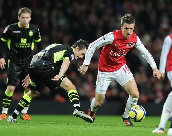 Arsenal's Aaron Ramsey Scores Past Leeds Danny Pugh in FA Cup Third Round Clash