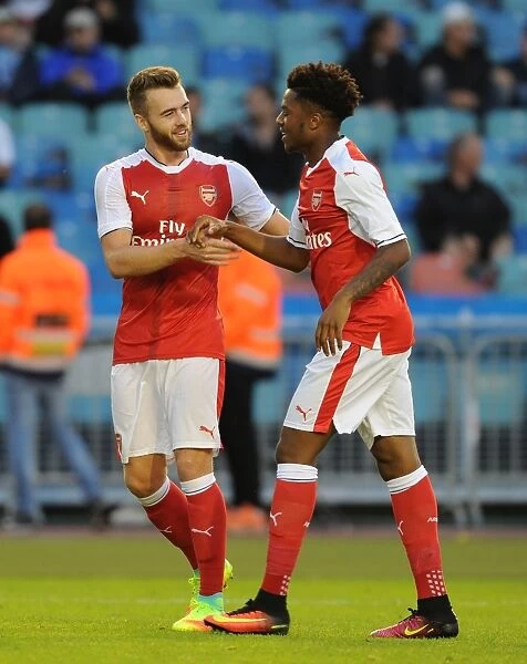 Arsenal's Akpom and Chambers Celebrate Goal Against Manchester City in 2016 Pre-Season Friendly