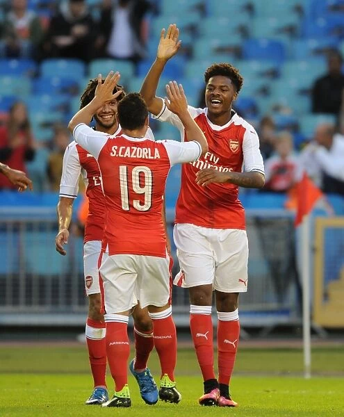 Arsenal's Akpom, Elneny, and Cazorla Celebrate Goal Against Manchester City in 2016-17 Pre-Season Friendly