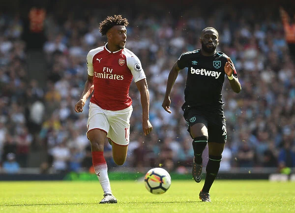 Arsenal's Alex Iwobi Clashes with West Ham's Arthur Masuaku in Premier League Showdown