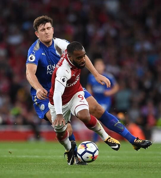 Arsenal's Alexandre Lacazette Clashes with Leicester's Harry Maguire in 2017-18 Premier League Showdown