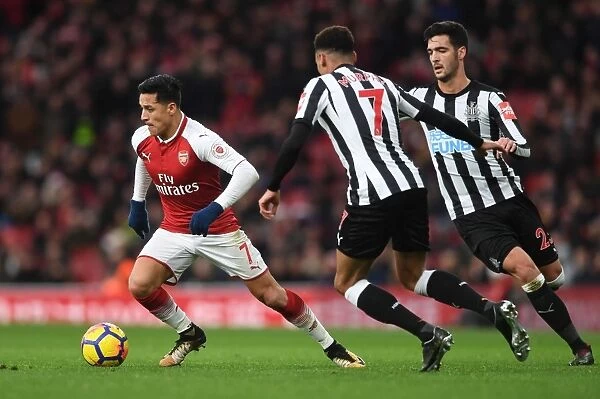 Arsenal's Alexis Sanchez Faces Off Against Newcastle's Mikel Merino and Jacob Murphy in Intense Premier League Clash