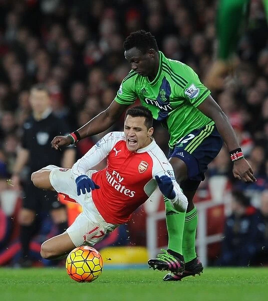 Arsenal's Alexis Sanchez Fouls by Southampton's Victor Wanyama in Premier League Clash