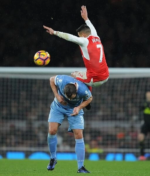 Arsenal's Alexis Sanchez Soars Above Stoke's Erik Pieters in Premier League Clash