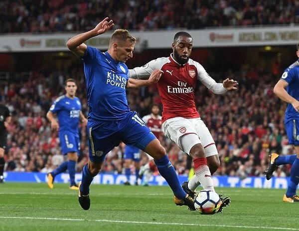 Arsenal's Alexis Squares Up Against Leicester's Albrighton in Premier League Clash