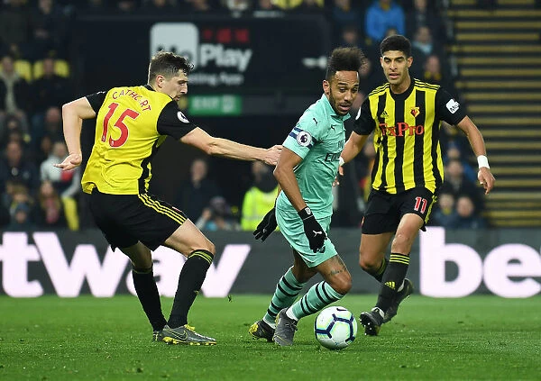 Arsenal's Aubameyang Faces Off Against Watford Defenders during Premier League Clash (2018-19)